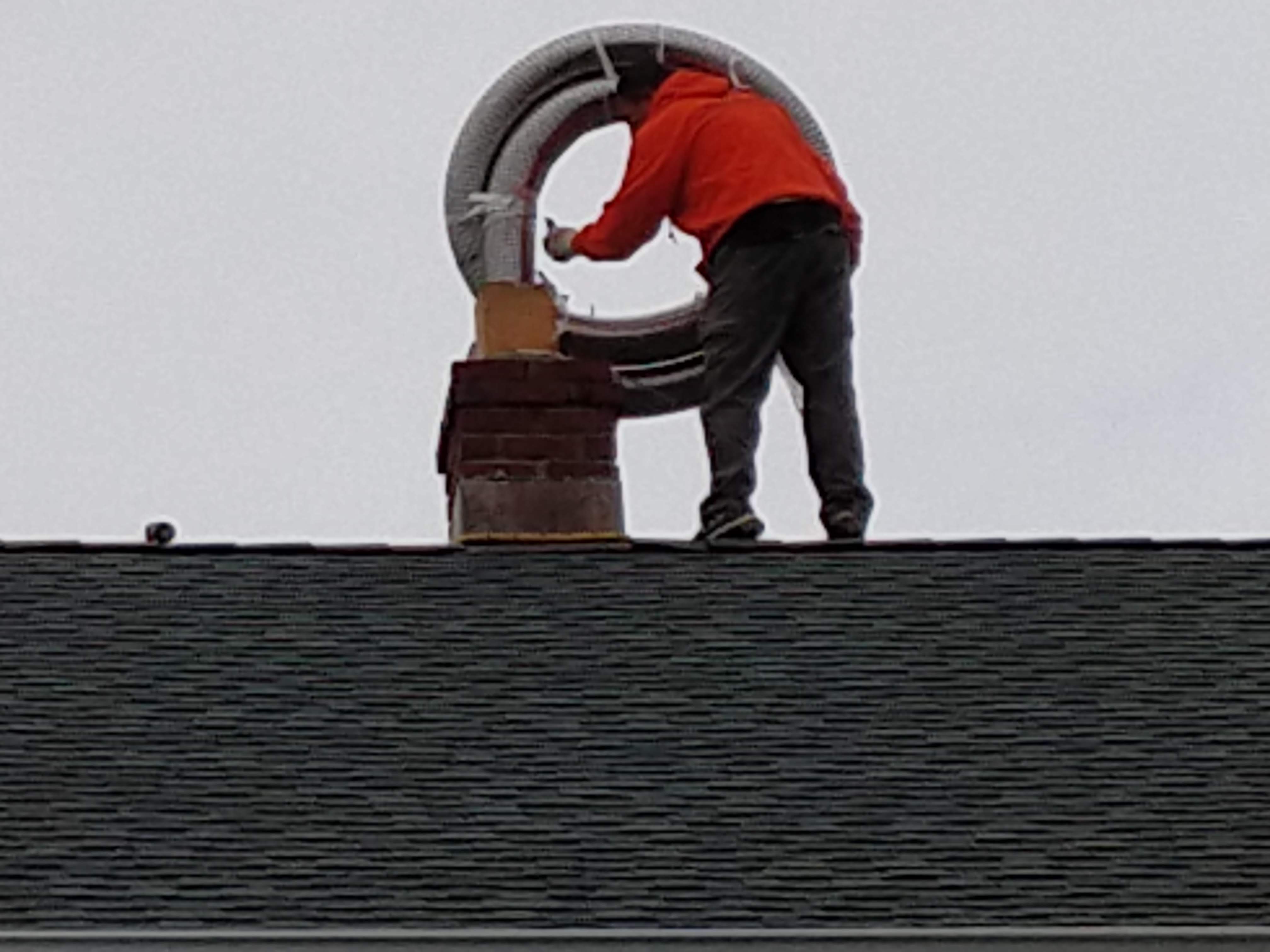 Flexible stainless chimney liner being installed in Lynbrook, New York